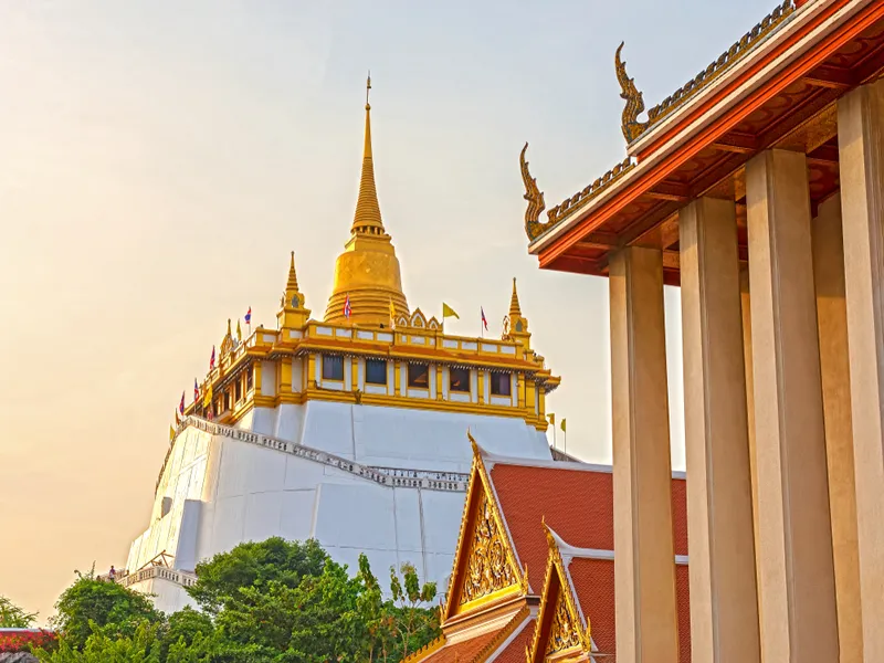 Low angle view(Evening time) of Golden Mountain at Wat Saket Ratcha Wora Maha Wihan, Bangkok, Thailand.
