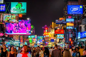 Bangkok, Thailand - February 26, 2018 : Tourists enjoying Khao San Road, Khao San road is a famous place for sight-seeing and eating at night in Bangkok.