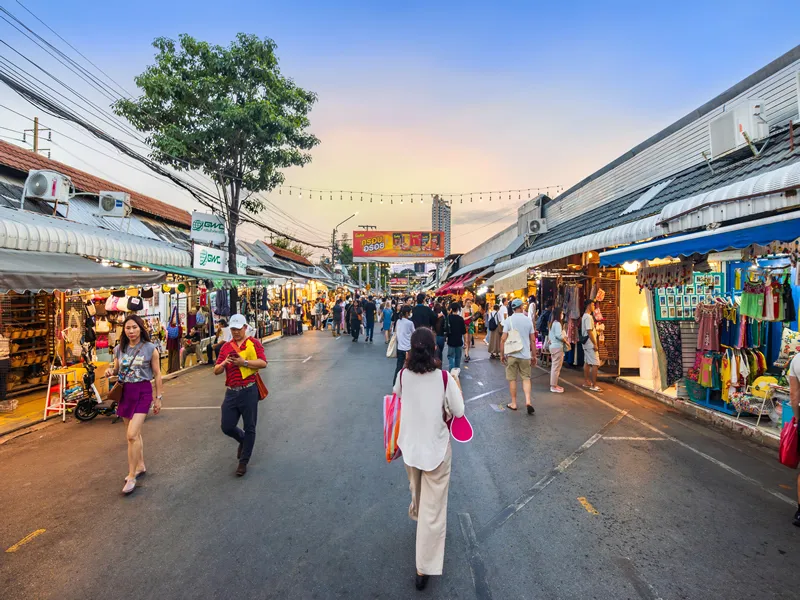 Bangkok, Thailand-December 16, 2023: Chatuchak Weekend Market, at sunset, becomes increasingly crowded with people and tourists who come out to shop, especially after it was quiet due to the COVID-19