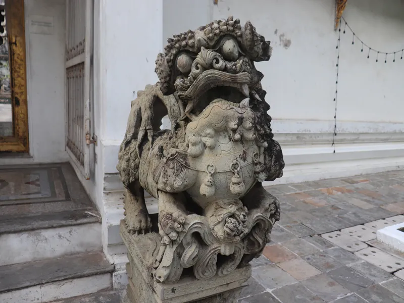 Bangkok, Thailand - April 8,2019 Close up Stone lions in Wat Suthat Thepphawararam Temples