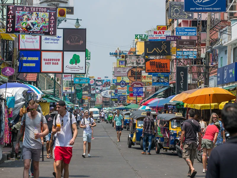 Bangkok, Thailand - March 5, 2017: Tourists and backpackers walk on Khao San Road in Bangkok, Thailand. Khao San Road is a famous low budget hotels and guesthouses area in Bangkok.