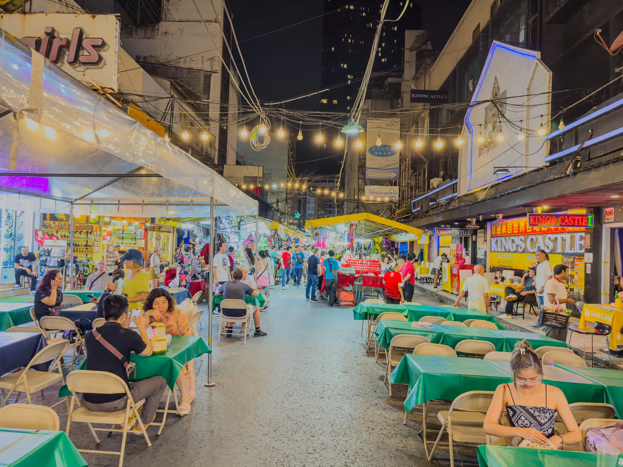Sunday 23 June 2024 Patpong night market in Silom Bangkok BKK at night colourful neon lights of the clubs and bars and vendors selling their stock