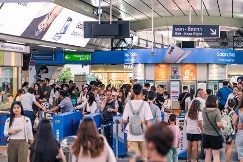 Bangkok Thailand JULY 26 2024: Crowd of People using the BTS SkyTrain at Siam Station.