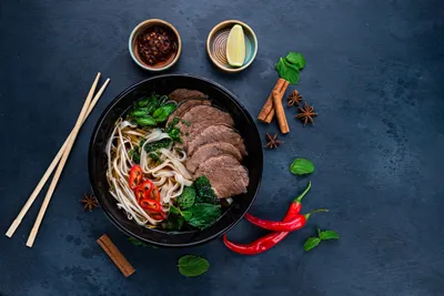 pho bo soup with beef, Pho bo Vietnamese food, rice noodle soup with sliced beef. Vietnamese fresh rice noodle soup with beef. Vietnam's national dish top view, flat lay