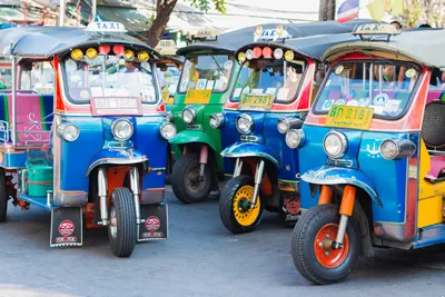 BANGKOK - MAR.13 : Thai Tuk Tuk taxi on Maharaj Road Rattanakosin Island of Bangkok on MAR.13, 2016 in Bangkok, Thailand.